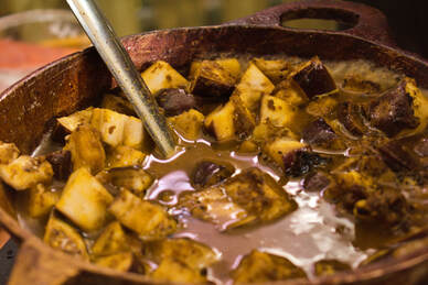 The 7 Curry Tour — seven Guyanese curries served on lotus leaf plates