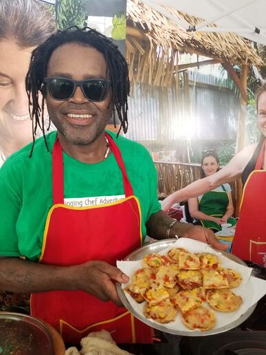 Eon John — The Singing Chef in his branded apron