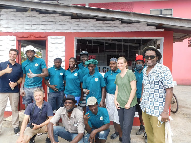 Tour group at Tony's Dhal Puri Shop with Eon John and the Favorite family