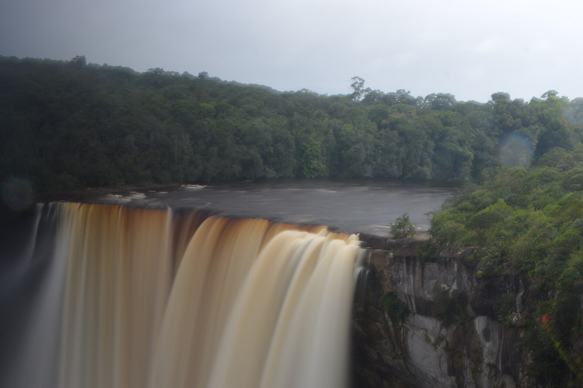 Long exposure photograph of Kaieteur Falls from the rim showing silky smooth water